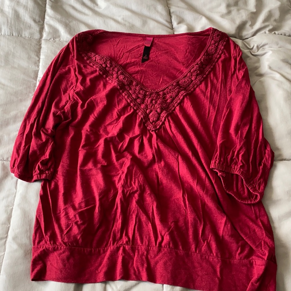 Woman’s dark red top